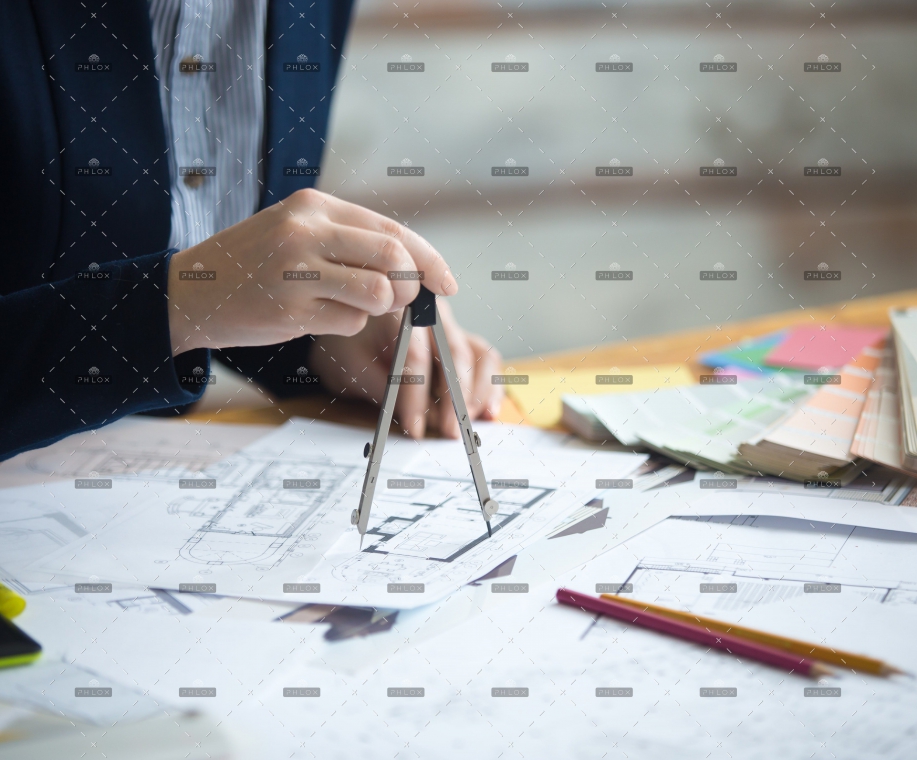 demo-attachment-13-female-architect-using-drawing-compass-PZNMCEU-min